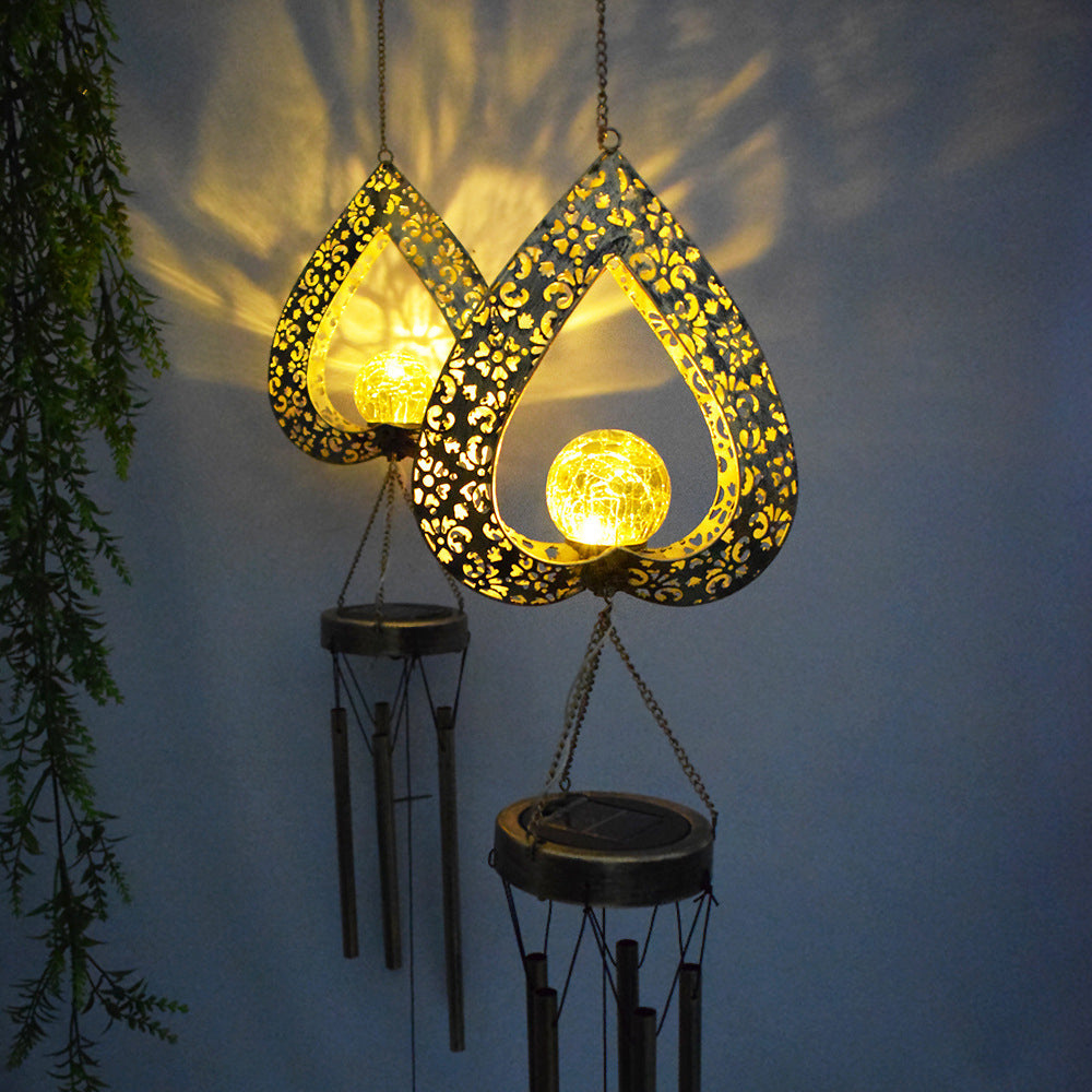 Solar Hanging Lights with Iron Heart Design and Wind Chimes – Waterproof LED Garden Decor for Outdoor Ambiance